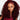 Model wearing Ali Grace 99J Burgundy Kinky Curly pre-separated knotless crochet 100% human hair extensions for boho braids, featuring feather-soft curls, vibrant burgundy color, and a natural-looking finish.