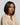 Woman wearing an Ali Grace short bob human hair wig featuring a sleek, lightweight style with a natural and modern finish.