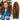 Ali Grace #4/27 Highlight Burmese Curly Crochet Human Hair Extension shown on a model with the product, showcasing soft defined curls, natural highlight blend and premium human hair quality for protective styles.