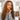 Ali Grace #4/27 Highlight Kinky Curly Human Hair Crochet Extension on model showing natural curl texture, voluminous style, soft feel and seamless blending