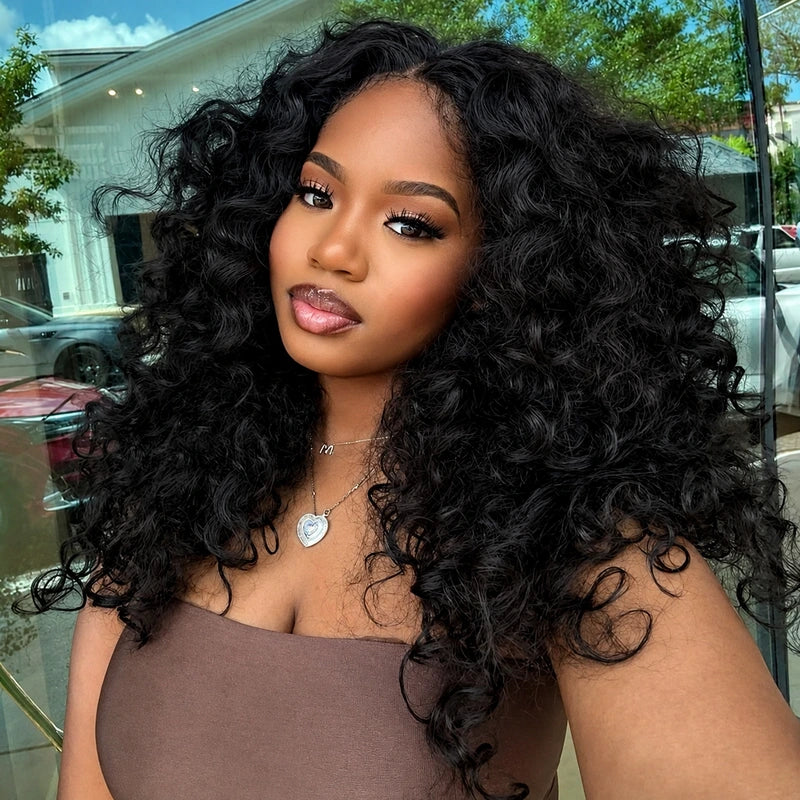 Model wearing Ali Grace Transparent Lace Front Natural Color Curly Human Hair Wig with soft defined curls, transparent lace and a natural-looking hairline.